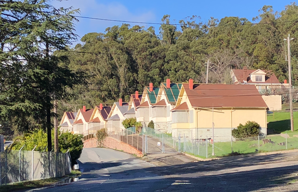 Race against rain: tarps cover Winehaven cottages amid preservation lawsuit